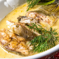 fried christmas carp in butter sauce with dill and lemon