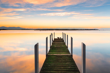 Fototapeta na wymiar Perfect serenity - timber jetty and reflections