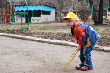 little girl with broom