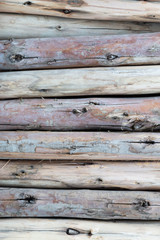 Close up of stack spilled cutting dry wood logs textured background.