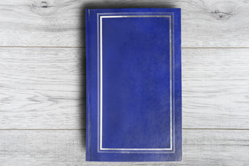 Book on wooden background