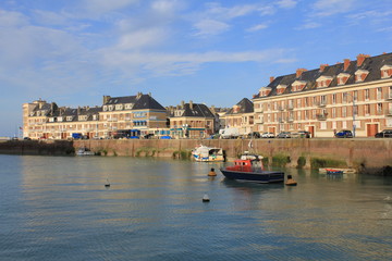 the harbor in the beautiful seaside town saint valery en caux, normandy in the evening sunshine