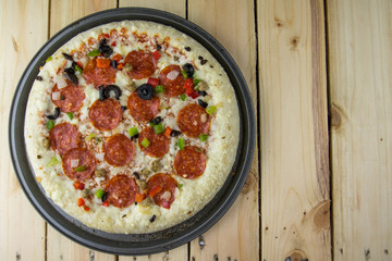 Delicious pepperoni pizza on wooden table.