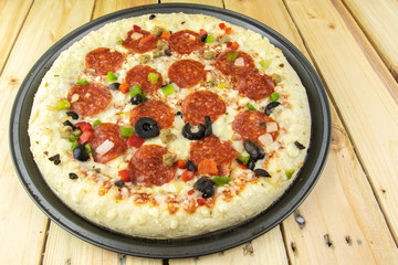 Delicious pepperoni pizza on wooden table.