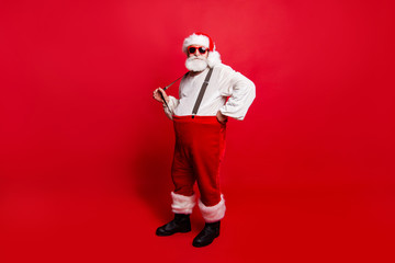 Fototapeta na wymiar Full length body size of nice calm peaceful Santa pulling suspen