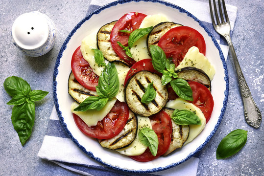 Italian salad caprese with eggplants and balsamic vinegar.Top view with copy space.
