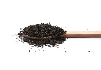Black tea leaves with wooden spoon isolated on white background