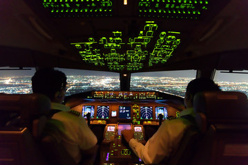 Asian airline pilots were operating commercial aircraft on approach phase over city on the night....
