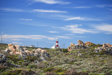 Fototapeta na wymiar Tourist landmark lighthouse on a hill in the Southern most point of Africa, Cape Agulhas.