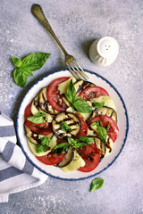 Italian salad caprese with eggplants and balsamic vinegar.Top view with copy space.