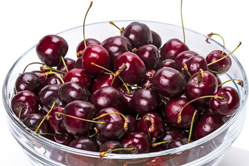 Ripe cherry in a glass bowl closeup