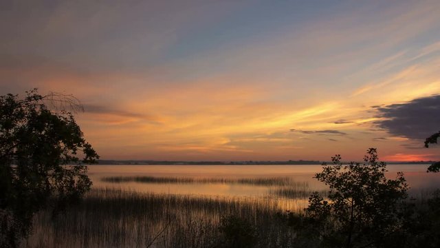 Beautiful dawn over the lake, time lapse.
