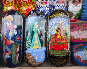 Palekh caskets with miniature painting (paint papier-mâché boxes) at the flea market Izmailovo. Moscow, Russia. March, 2007