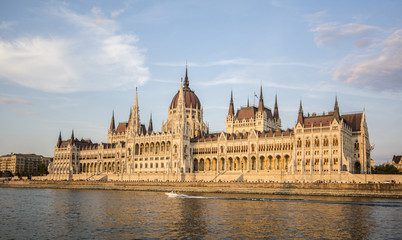 Fototapeta na wymiar The Hungarian Parliament is at sunset on the banks of the Danube. Budapest. One of the most beautiful buildings in the Hungarian capital