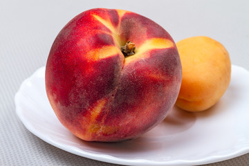 Peach and apricot on a plate