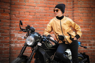 Fototapeta na wymiar Woman and retro cafe racer motorcycle