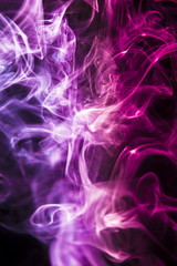 Colored smoke on black background