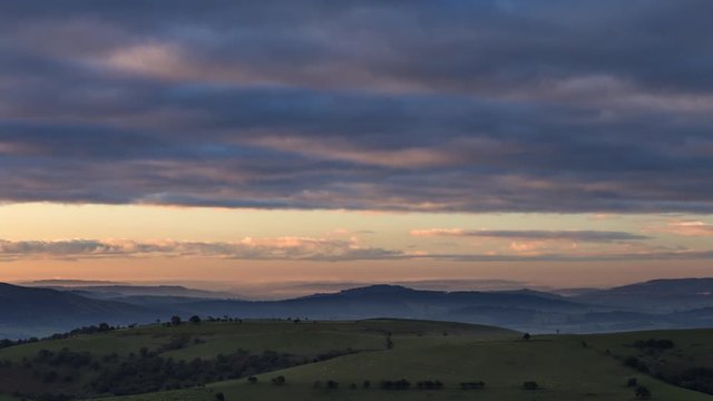 Sunrise Clouds over Scenic Hills in UK
