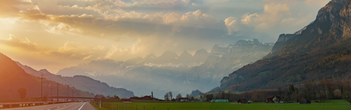 Highway road to Geneva with fantastic Alpine view in Switzerland during sunset