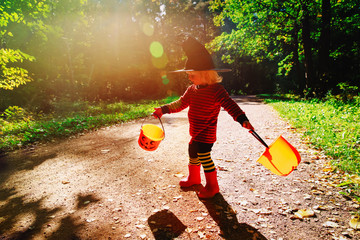 little girl trick or treat in nature, prepare for halloween