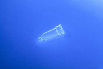 Plastic medical column for test tube stay alone on the blue background