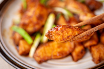 Delicious homemade stewed fish slices with scallion in wooden background, Taiwan delicacies, top view, copy space