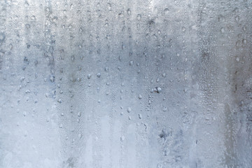 Winter background from lot of  frozen  water drops on window.