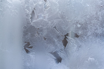 Delicate translucent ice pattern on window. 