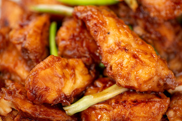 Delicious homemade stewed fish slices with scallion in wooden background, Taiwan delicacies, top view, copy space