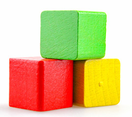 Wooden building blocks isolated on white background.