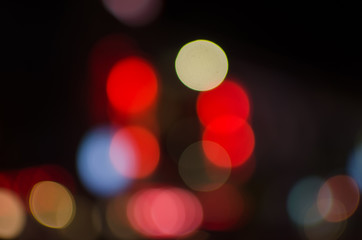 Abstract city night defocused light, blur bokeh, colorful & dark background. Artistic, dreamy, street & backdrop.