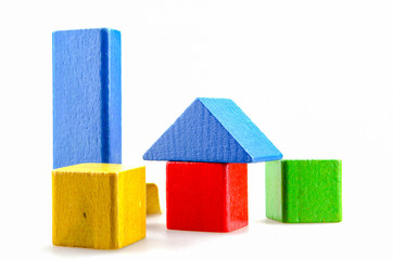 Wooden building blocks isolated on white background.