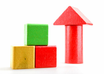 Wooden building blocks isolated on white background.