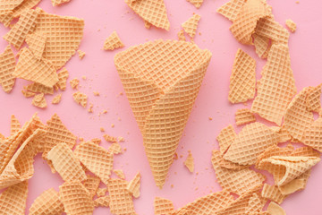 Ice cream waffle cones on pastel pink background