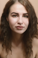 Fototapeta premium Portrait of beautiful emotional woman with green eyes. Studio shot.