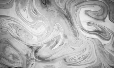 Abstract monochrome marble background. Stains of paint on the water. Ebru art, marbled paper.