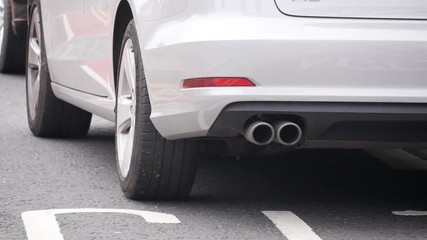 Car exhaust pipe, car pulls away