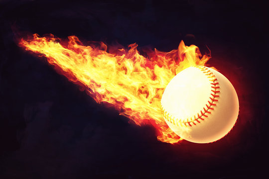 3d rendering of a white baseball ball with red seams is caught in flames while it flies on dark background.