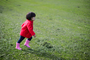 baby girl play in autumn forest park