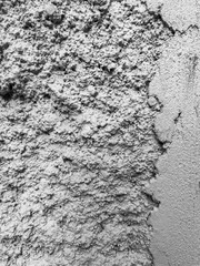 Gray plaster coat on the wall as a background