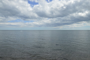 Fototapeta premium Calm Sea English Channel Fluffy Clouds