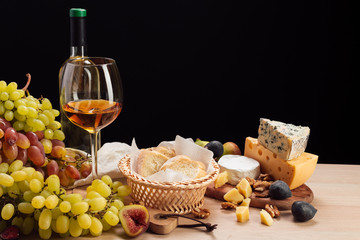 Fototapeta na wymiar Wine and cheese on the table