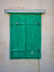 Obraz na płótnie Canvas Green window on a wall.