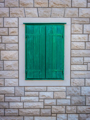 Green window on a wall.