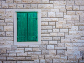 Green window on a wall.