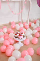 Decorations for children birthday. Decorations for holiday party. A lot of balloons pink and white colors. 