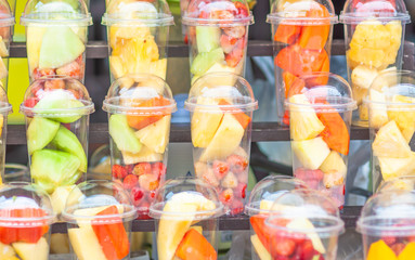 Fresh mix fruit in glasses prepare for blended menu - colorful fresh fruit background concept