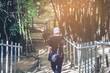 photographer traveling into the forest for beautiful forest pictures