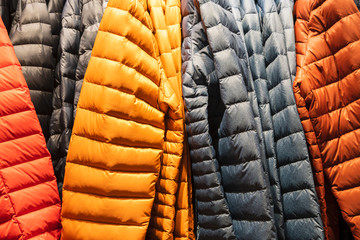 Colorful winter sports jacket on a hanger in the store