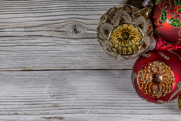 Christmas still life - few red Christmas baubles on old wood